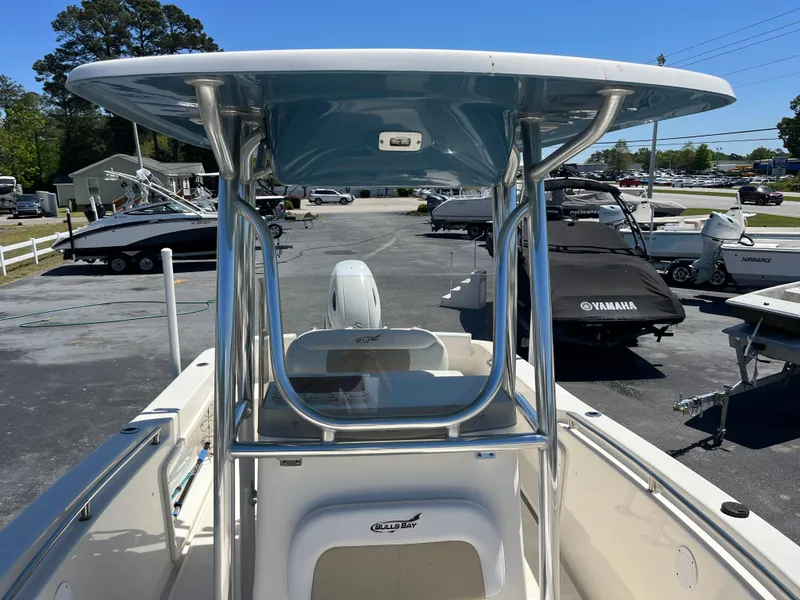 Slide: The Image of 2020 Bulls Bay 230 Center Console boat with T-top in a marina setting. - 17