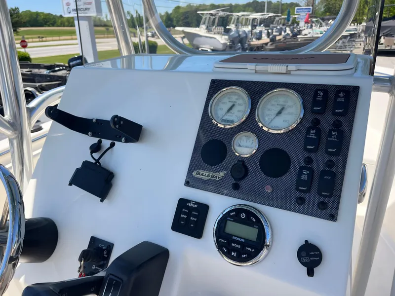 Slide: The Image of 2020 Bulls Bay 230 Center Console dashboard with gauges and controls. - 21