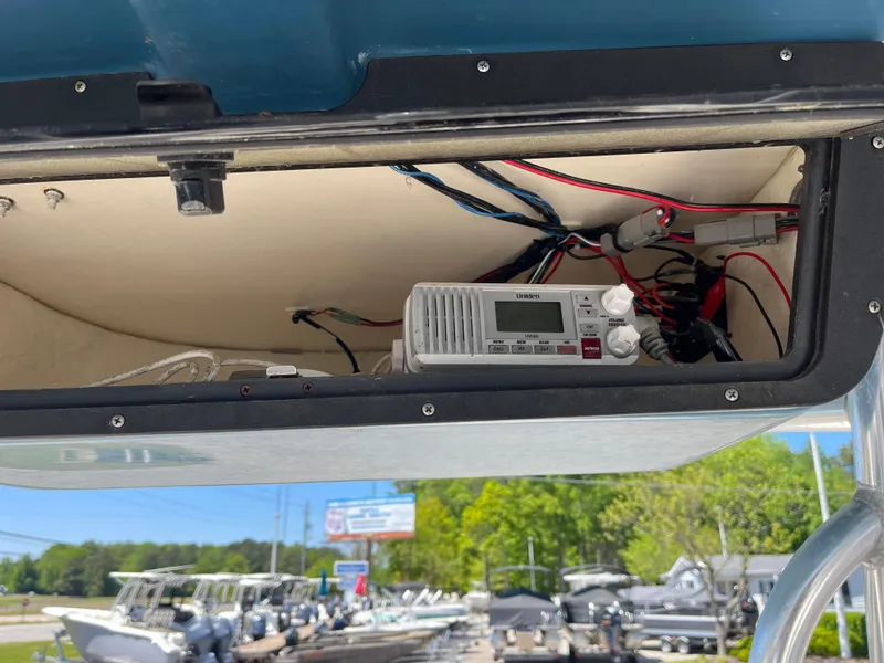 Slide: The Image of 2020 Bulls Bay 230 Center Console boat with electronic equipment in storage compartment. - 22