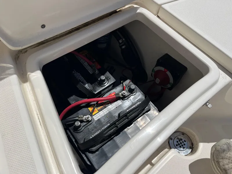 Slide: The Image of Battery compartment of 2020 Bulls Bay 230 Center Console boat, showing wiring and connections. - 23