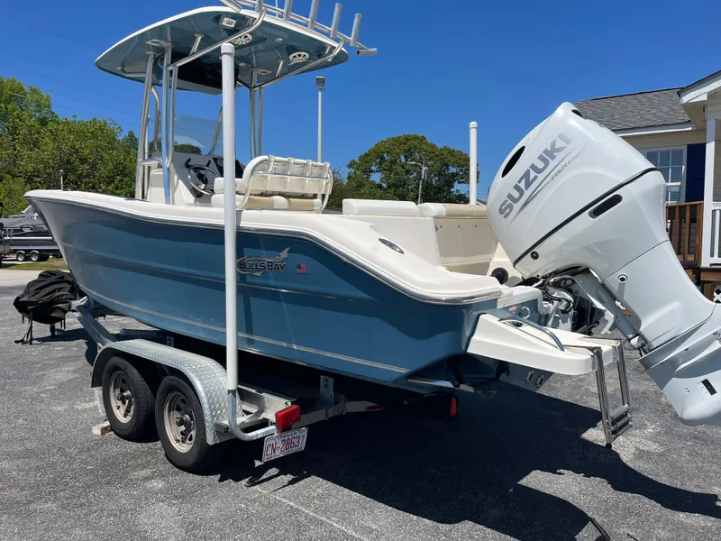 Slide: The Image of 2020 Bulls Bay 230 Center Console boat with Suzuki outboard motor on a trailer. - 4