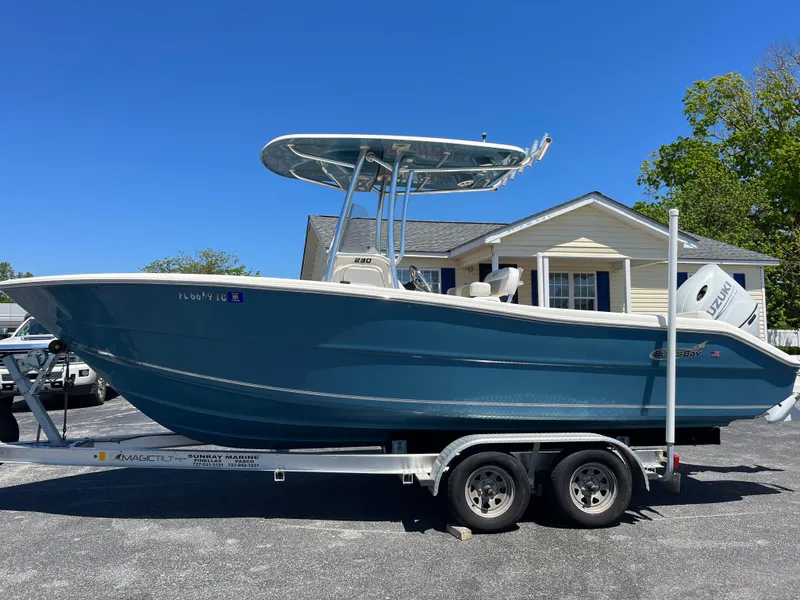Slide: The Image of 2020 Bulls Bay 230 Center Console boat on trailer, parked in front of a house. - 5
