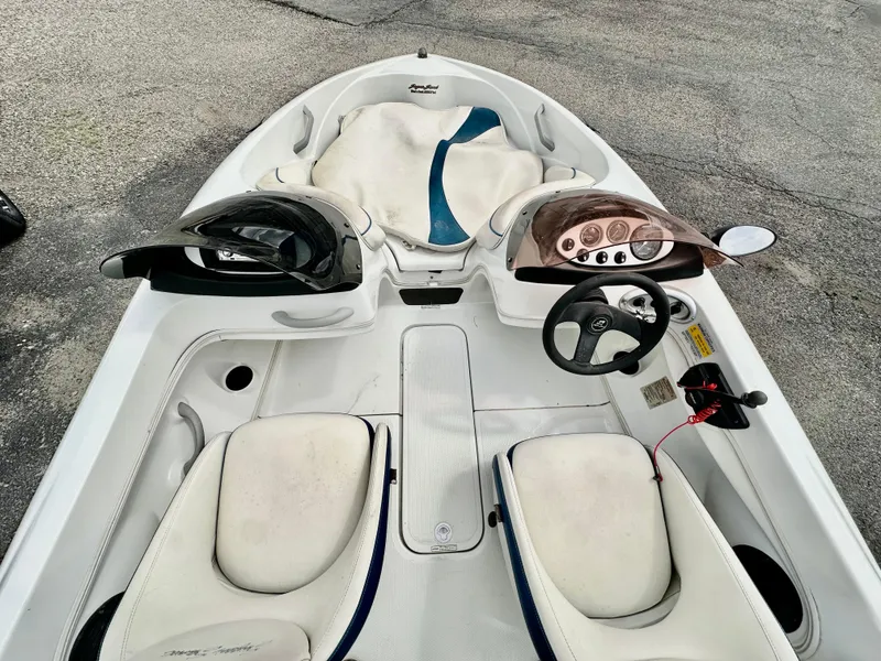 Slide: The Image of 2007 Tango Super Sport boat interior with dual seats and steering console. - 6