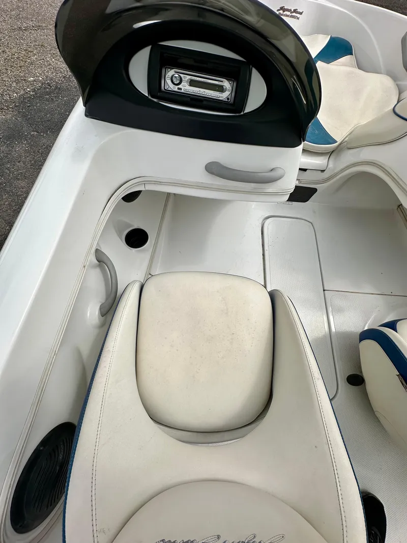 Slide: The Image of 2007 Tango Super Sport boat interior with white seating and dashboard controls. - 8