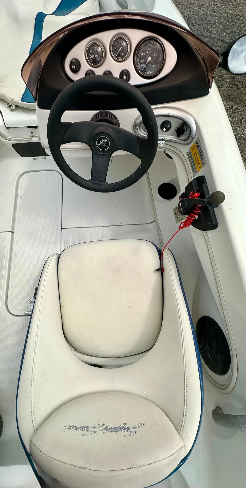 Slide: The Image of 2007 Tango Super Sport boat cockpit with steering wheel and dashboard controls. - 9