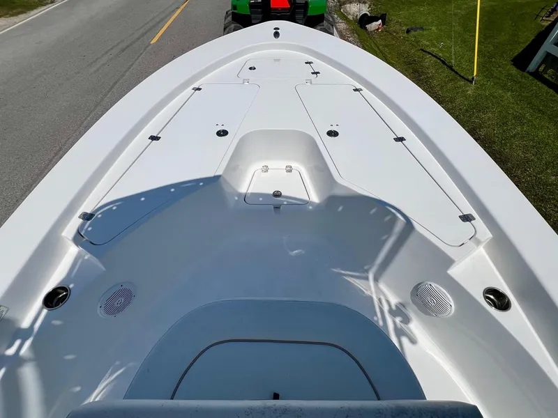 Slide: The Image of 2013 Sportsman Masters 227 Bay Boat deck, showing storage compartments and clean design. - 14