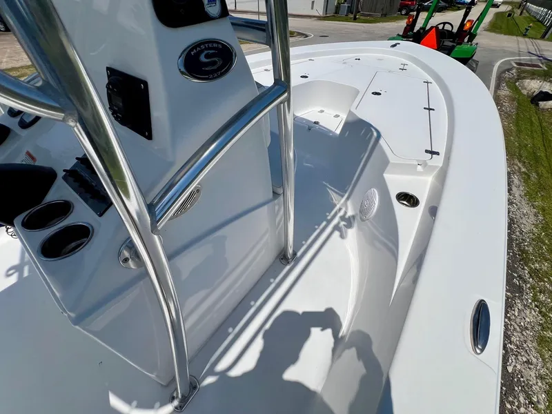 Slide: The Image of 2013 Sportsman Masters 227 Bay Boat deck with console and stainless steel railings. - 15