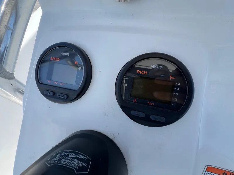 Slide: The Image of Yamaha speed and tachometer gauges on 2013 Sportsman Masters 227 Bay Boat dashboard. - 17