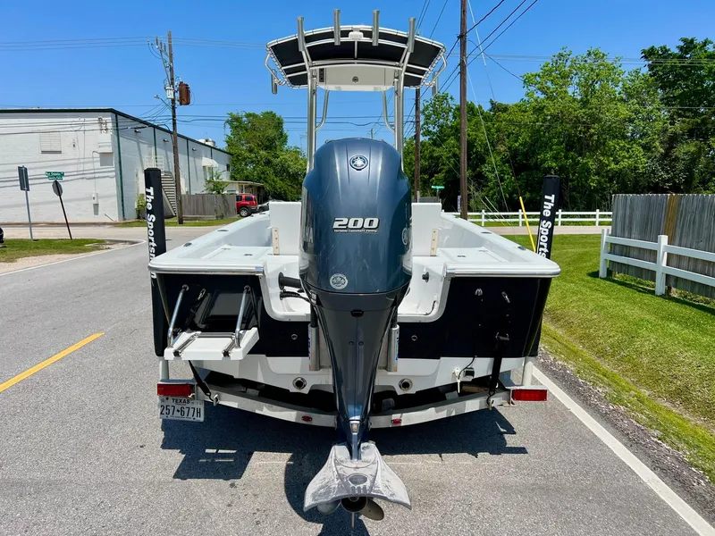 Slide: The Image of 2013 Sportsman Masters 227 Bay Boat with 200 HP engine on a sunny street. - 3
