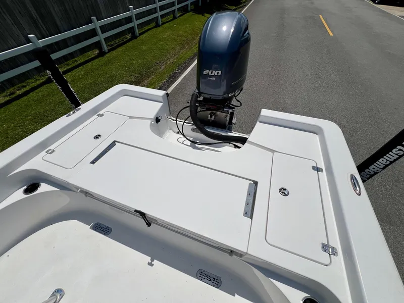 Slide: The Image of 2013 Sportsman Masters 227 Bay Boat with Yamaha 200 engine on a road. - 8
