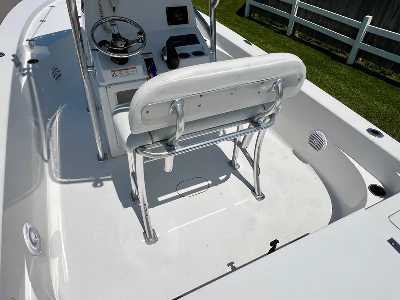 Slide: The Image of 2013 Sportsman Masters 227 Bay Boat interior with steering console and seating. - 9
