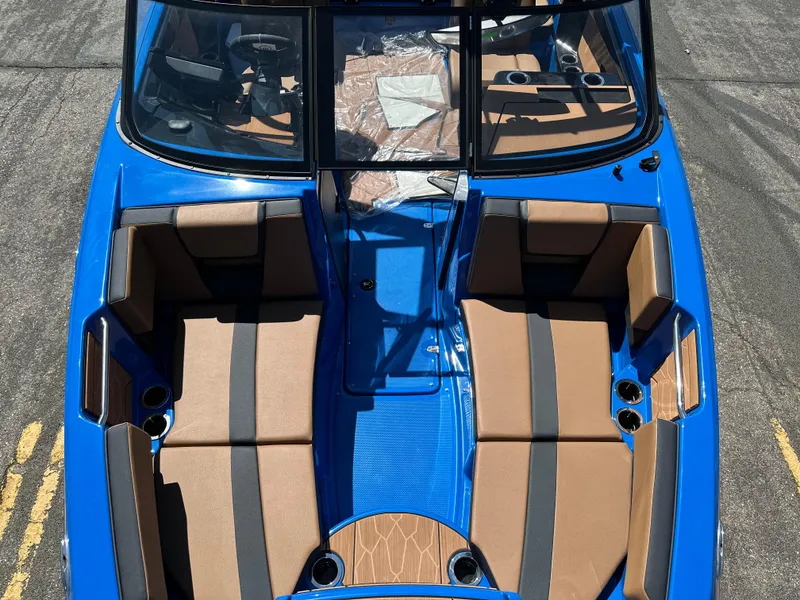 Slide: The Image of 2025 Yamaha Boats 222XE, blue and brown interior, aerial view. - 8