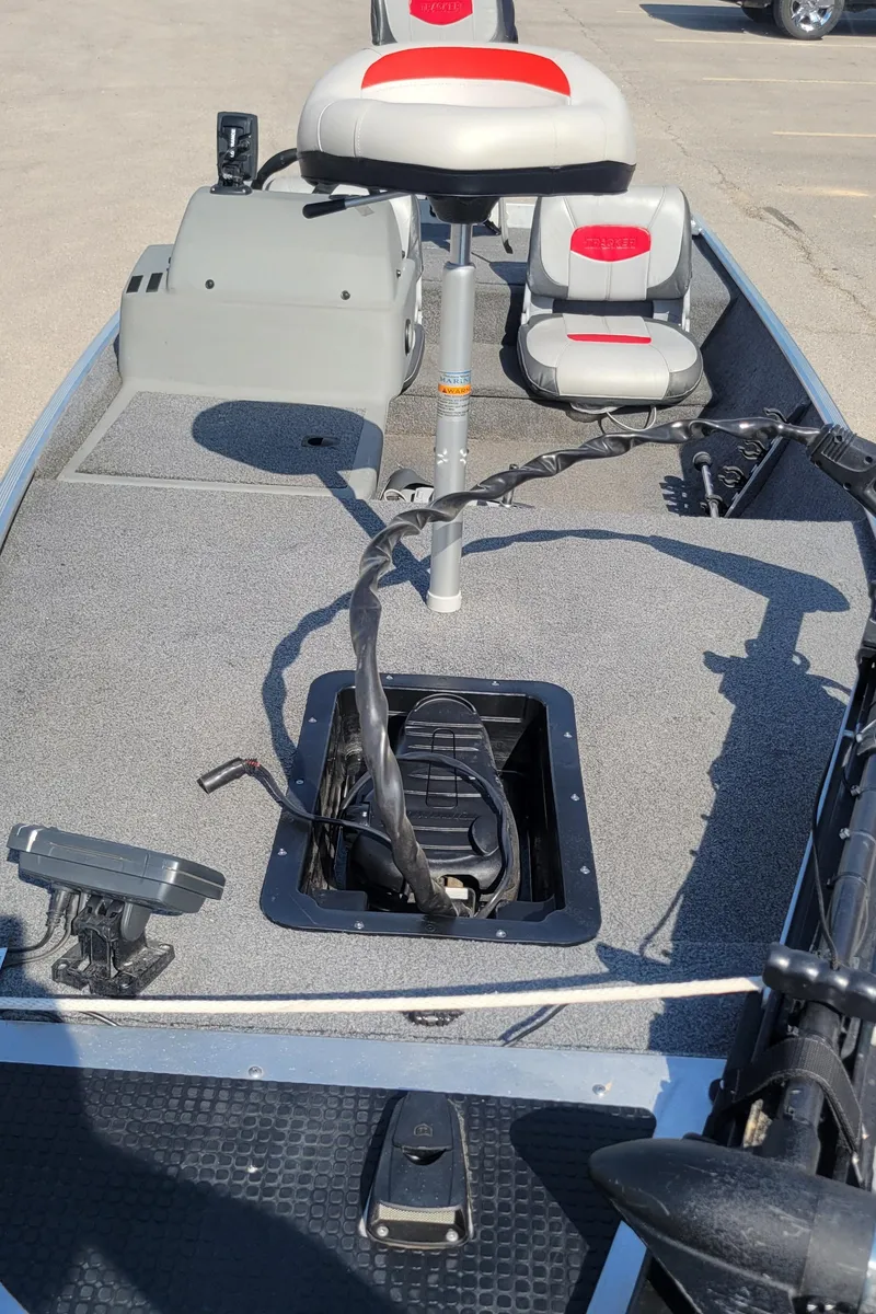 Slide: The Image of 2016 Tracker PRO160 fishing boat interior with seating and storage compartments. - 3