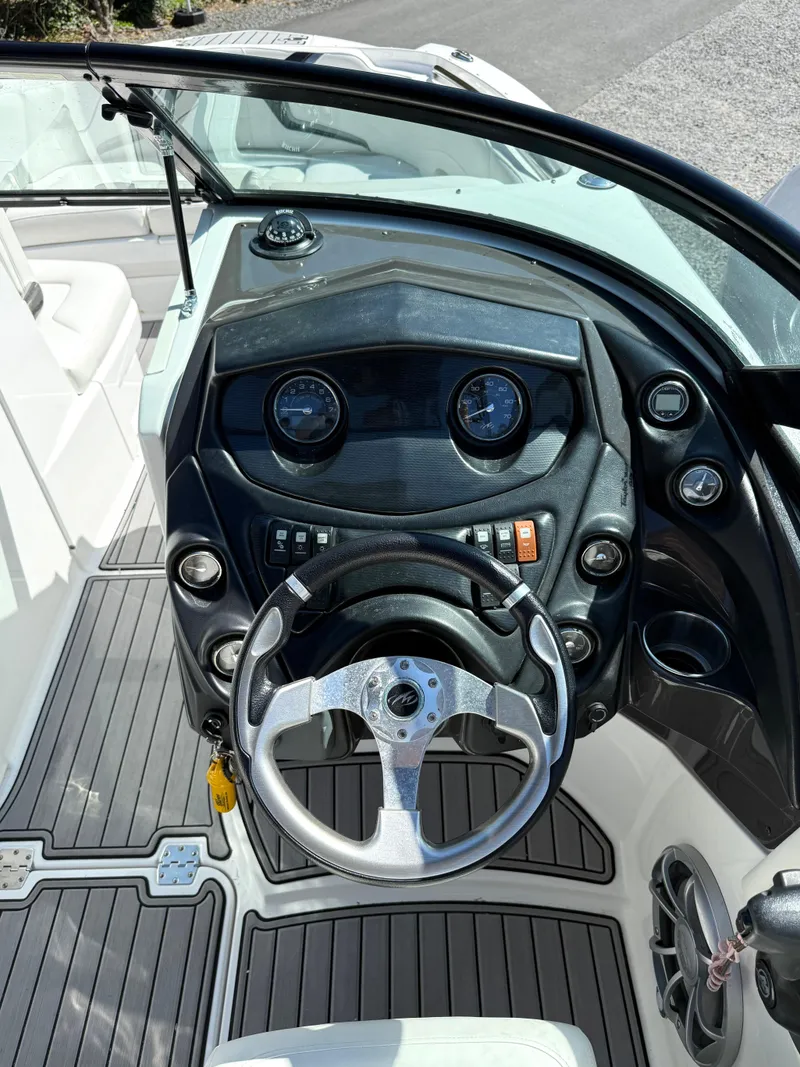 Slide: The Image of 2014 Monterey M5 Sport Boat dashboard with steering wheel and instrument panel. - 11