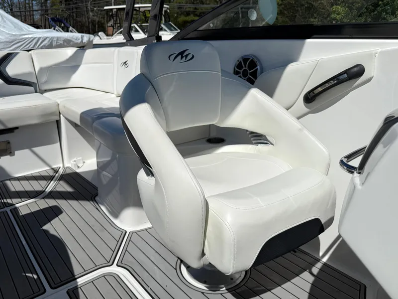Slide: The Image of 2014 Monterey M5 Sport Boat interior with white seating and modern design. - 13