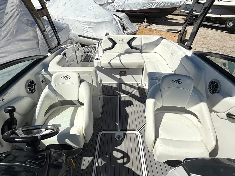 Slide: The Image of 2014 Monterey M5 Sport Boat interior with white seating and modern design. - 15