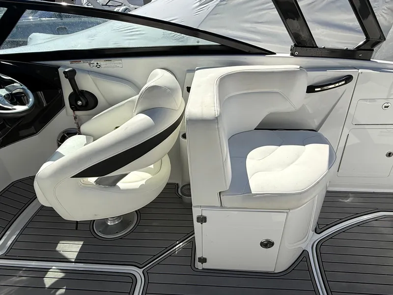 Slide: The Image of 2014 Monterey M5 Sport Boat interior with white seating and sleek design. - 17