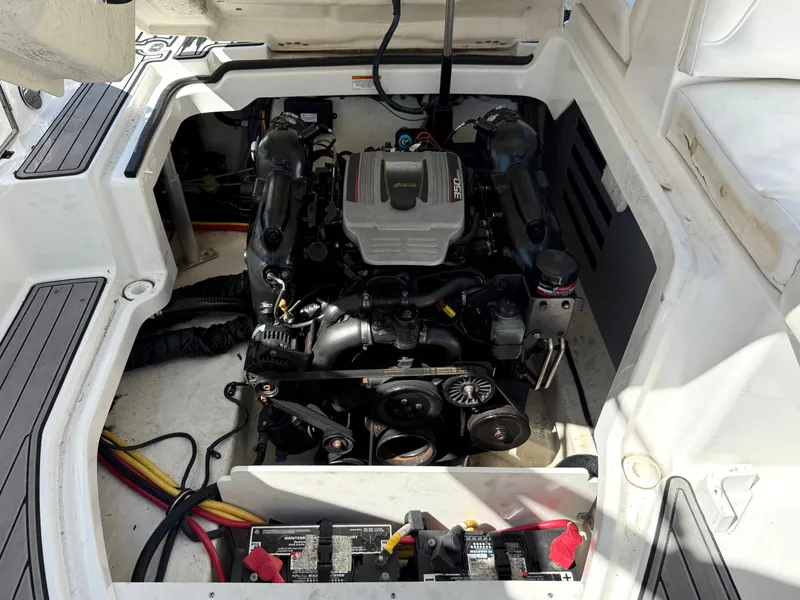 Slide: The Image of Engine compartment of a 2014 Monterey M5 Sport Boat, showcasing detailed mechanical components. - 21