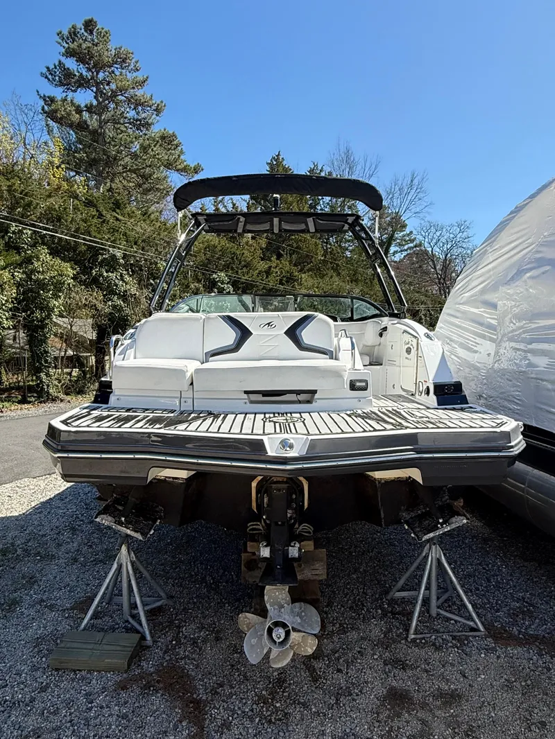 Slide: The Image of 2014 Monterey M5 Sport Boat on stands, rear view, outdoors. - 5