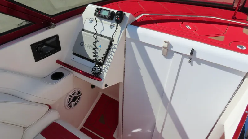 Slide: The Image of 2002 Fountain 47 Lightning boat interior with red and white design, featuring navigation equipment. - 10