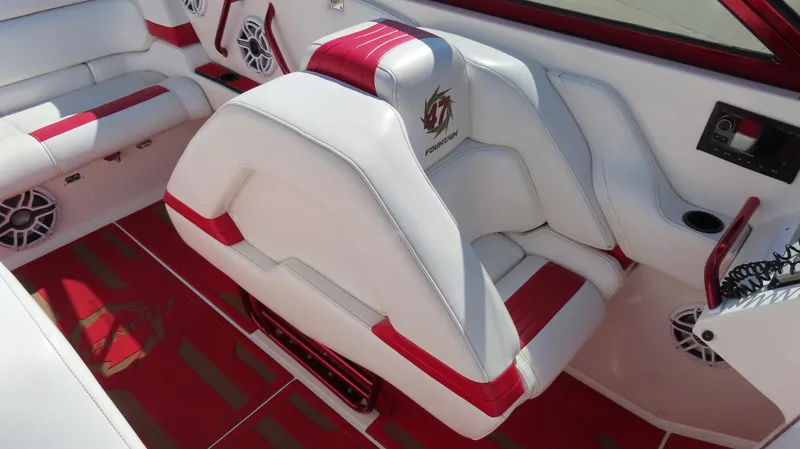 Slide: The Image of 2002 Fountain 47 Lightning boat interior with red and white seating and audio system. - 14