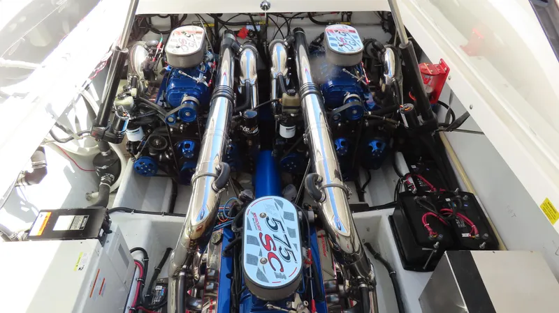 Slide: The Image of Engine compartment of a 2002 Fountain 47 Lightning boat, showcasing dual high-performance engines. - 16