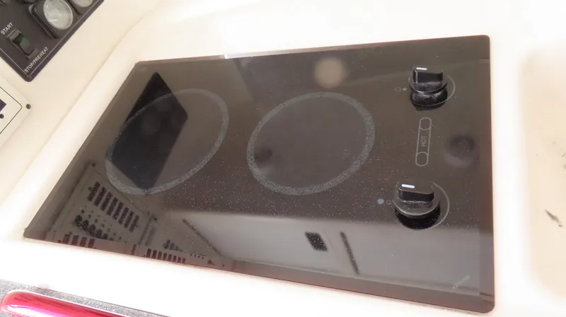 Slide: The Image of Ceramic cooktop with two burners on a 2002 Fountain 47 Lightning boat. - 21