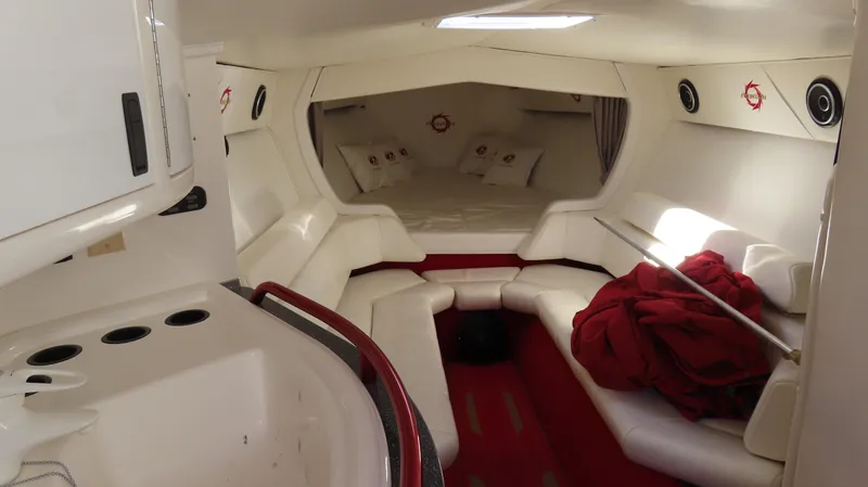 Slide: The Image of Interior of 2002 Fountain 47 Lightning boat with white seating and red accents. - 24