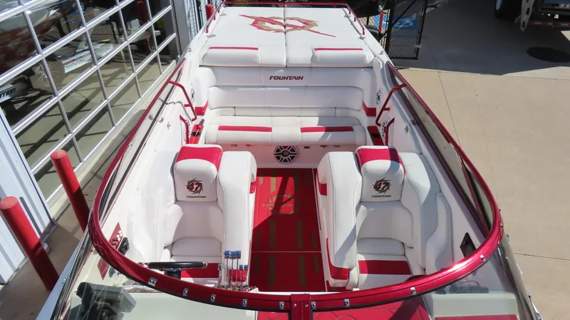 Slide: The Image of 2002 Fountain 47 Lightning boat interior with red and white seating and logo detailing. - 29