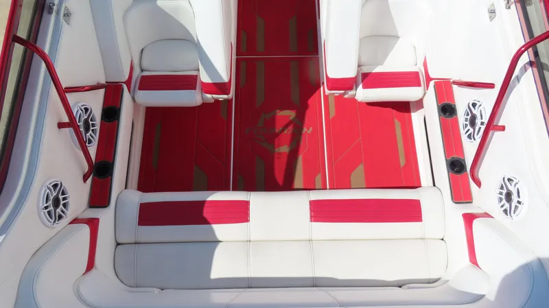 Slide: The Image of 2002 Fountain 47 Lightning boat interior with red and white seating and speakers. - 33