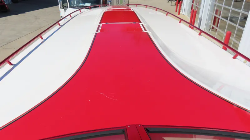 Slide: The Image of Top view of a 2002 Fountain 47 Lightning boat with red and white design. - 34