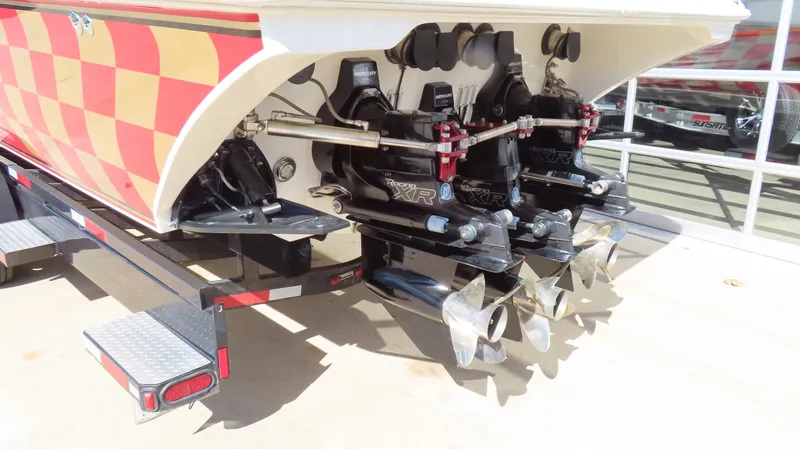 Slide: The Image of Rear view of a 2002 Fountain 47 Lightning boat with dual propellers. - 38