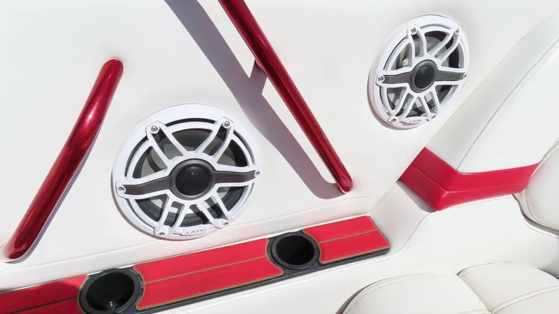 Slide: The Image of Interior of 2002 Fountain 47 Lightning boat with speakers and red accents. - 7