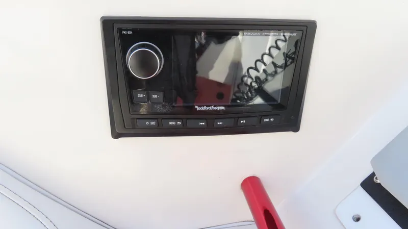Slide: The Image of Rockford Fosgate stereo system on 2002 Fountain 47 Lightning boat dashboard. - 9