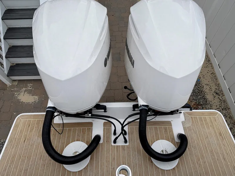Slide: The Image of 2018 Regulator 28 boat with dual outboard engines, viewed from above. - 13
