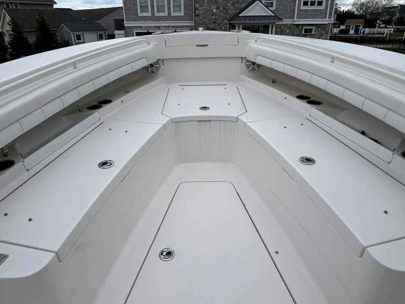 Slide: The Image of 2018 Regulator 28 boat interior with spacious seating and storage compartments. - 14