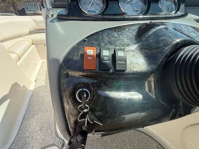 Slide: The Image of Dashboard of a 2008 Monterey 194FS boat with switches and key ignition. - 10