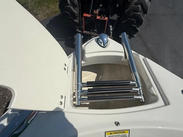 Slide: The Image of 2008 Monterey 194FS boat with open hatch and retractable ladder. - 22