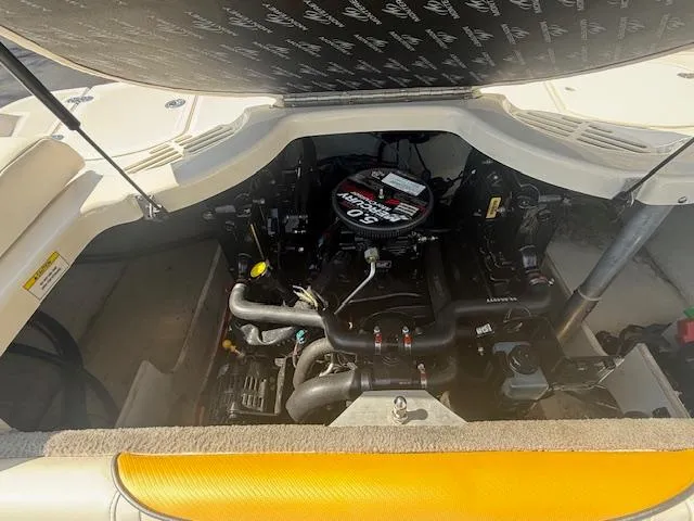 Slide: The Image of Engine compartment of a 2008 Monterey 194FS boat, showcasing detailed mechanical components. - 28