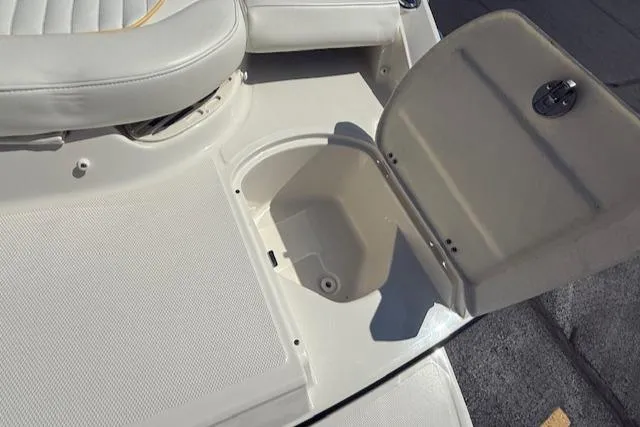 Slide: The Image of Open storage compartment on a 2008 Monterey 194FS boat deck. - 35