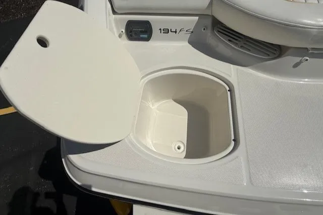 Slide: The Image of Open storage compartment on a 2008 Monterey 194FS boat. - 36