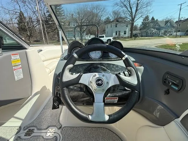 Slide: The Image of 2008 Monterey 194FS boat interior with steering wheel and dashboard view. - 8