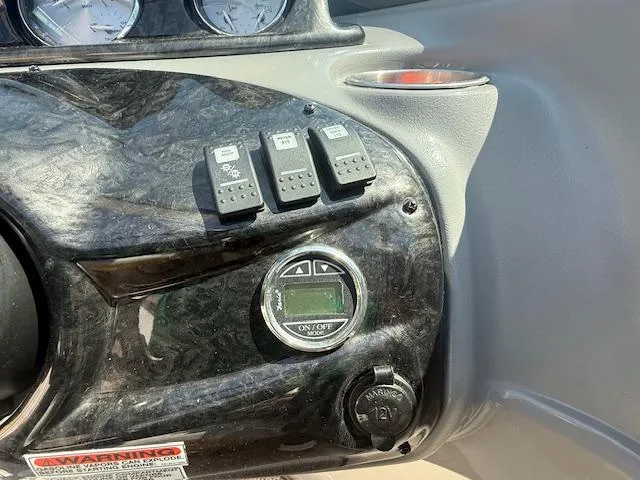 Slide: The Image of Dashboard of a 2008 Monterey 194FS boat with switches and gauges. - 9