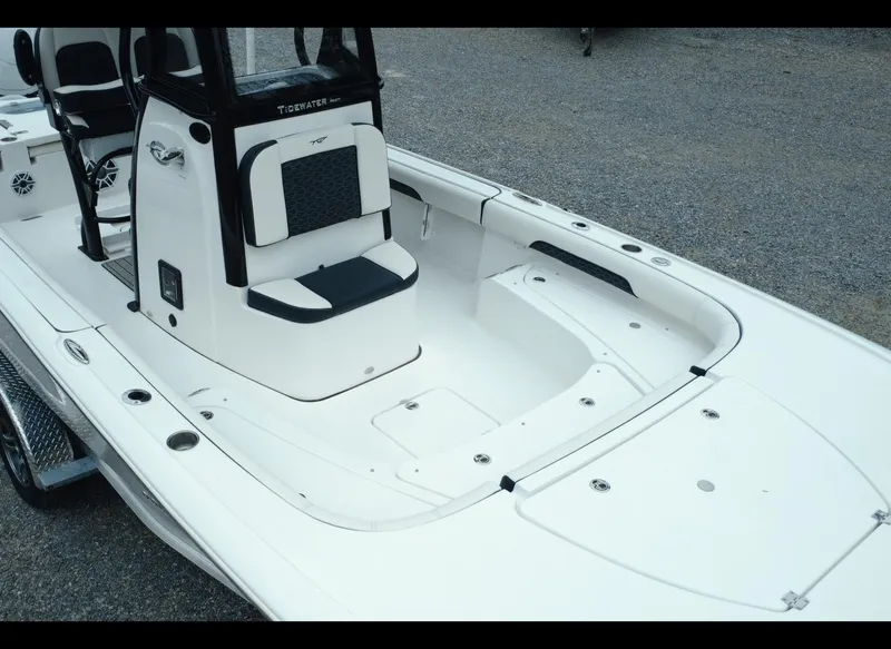 Slide: The Image of 2025 Tidewater 2500 Carolina Bay boat, white interior, spacious seating, sleek design. - 10