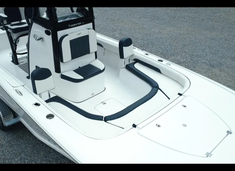 Slide: The Image of 2025 Tidewater 2500 Carolina Bay boat interior with seating and storage compartments. - 11