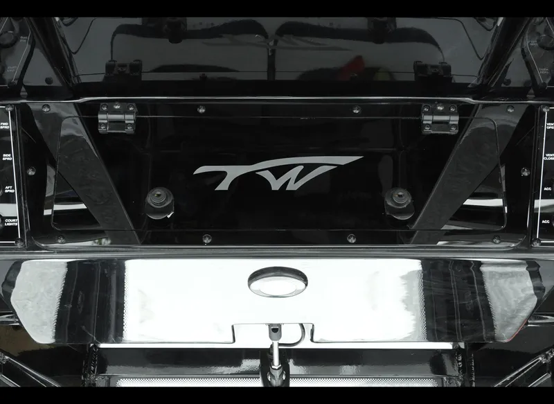 Slide: The Image of 2025 Tidewater 2500 Carolina Bay boat, featuring sleek black design and TW logo. - 18