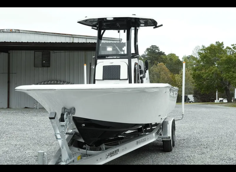 Slide: The Image of 2025 Tidewater 2500 Carolina Bay boat on trailer, parked outdoors. - 20