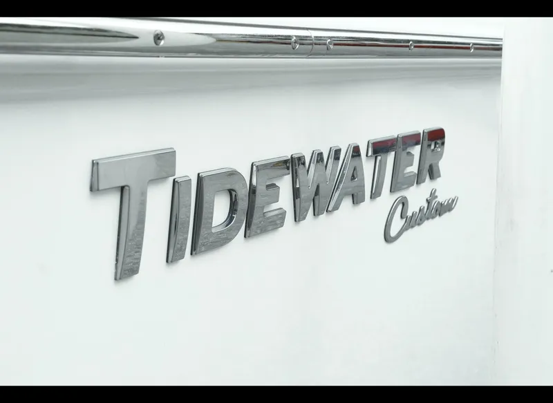 Slide: The Image of 2025 Tidewater 2500 Carolina Bay boat logo on white surface. - 22