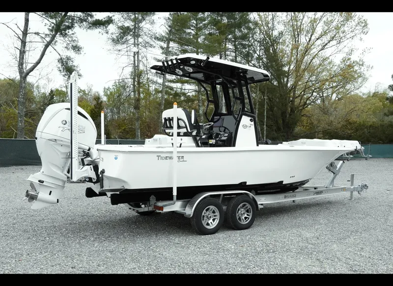 Slide: The Image of 2025 Tidewater 2500 Carolina Bay boat on trailer, parked outdoors. - 3