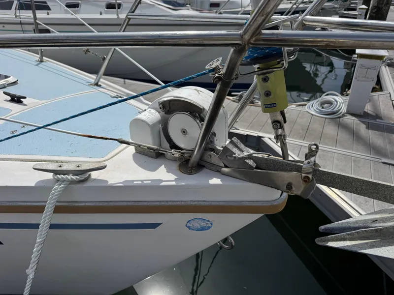 Slide: The Image of 1985 Catalina 30 sailboat bow with anchor and winch at marina dock. - 19